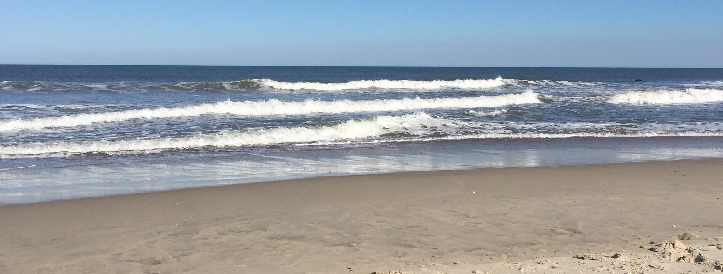 Waves breaking onto beach at Assateague Seashore